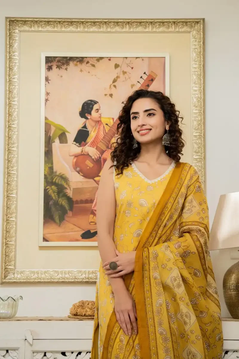 Yellow floral printed straight sleeveless kurti with pant and dupatta
